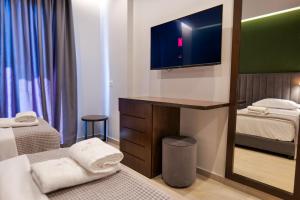 Postel nebo postele na pokoji v ubytování NERIUM Hotel