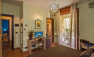 TV a/nebo společenská místnost v ubytování Hotel Gabrini