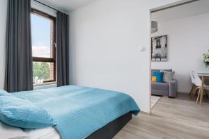 Postel nebo postele na pokoji v ubytování Elite Apartments Garnizon