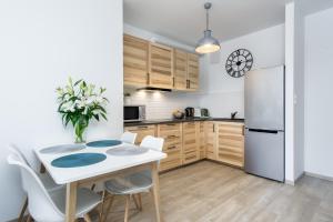 Kuchyň nebo kuchyňský kout v ubytování Elite Apartments Garnizon