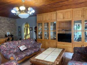 a living room with a couch and a coffee table at Serenity Garden Place in Hazyview