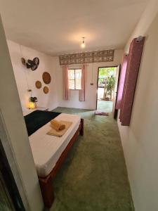 Postel nebo postele na pokoji v ubytování Phangan Villa Bungalows