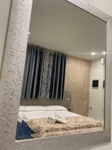 Posteľ alebo postele v izbe v ubytovaní Akoya Rooms Capo Vaticano
