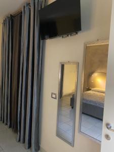Posteľ alebo postele v izbe v ubytovaní Akoya Rooms Capo Vaticano