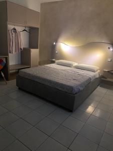 Posteľ alebo postele v izbe v ubytovaní Akoya Rooms Capo Vaticano