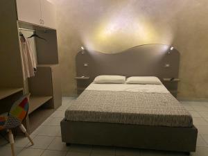 Posteľ alebo postele v izbe v ubytovaní Akoya Rooms Capo Vaticano