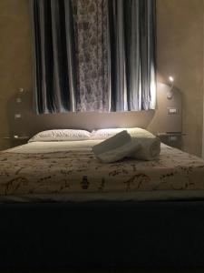 Posteľ alebo postele v izbe v ubytovaní Akoya Rooms Capo Vaticano