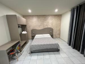 Posteľ alebo postele v izbe v ubytovaní Akoya Rooms Capo Vaticano
