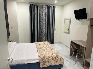 Posteľ alebo postele v izbe v ubytovaní Akoya Rooms Capo Vaticano