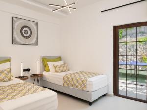 A bed or beds in a room at Anema Villa, a picture-perfect summer escape,By ThinkVilla