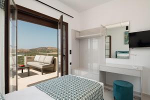 A television and/or entertainment centre at Anema Villa, a picture-perfect summer escape,By ThinkVilla