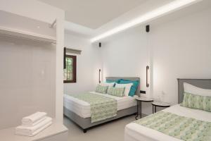 A bed or beds in a room at Anema Villa, a picture-perfect summer escape,By ThinkVilla