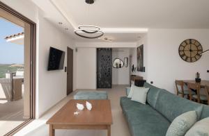 A television and/or entertainment centre at Anema Villa, a picture-perfect summer escape,By ThinkVilla