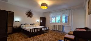 A bed or beds in a room at RelaxSpace Vendégház