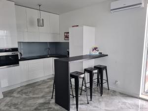 Kuchyňa alebo kuchynka v ubytovaní Apartament na Lazurowej