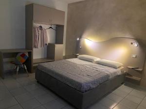Posteľ alebo postele v izbe v ubytovaní Akoya Rooms Capo Vaticano