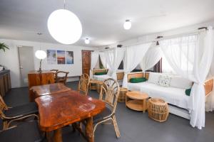 a living room with a couch and a table at 8 Colors Beach House Resort in Boracay
