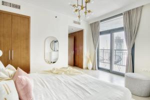 Postel nebo postele na pokoji v ubytování GuestReady - Prodigious Apt in Dubai Creek