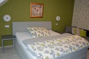 Posteľ alebo postele v izbe v ubytovaní Hotel Olga