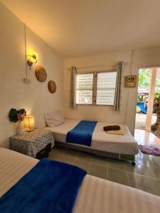 מיטה או מיטות בחדר ב-Phangan Villa Bungalows