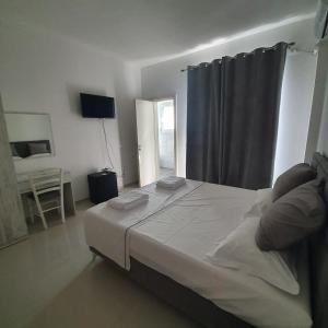 Postel nebo postele na pokoji v ubytování Hotel 33