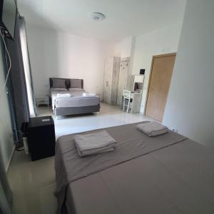 Postel nebo postele na pokoji v ubytování Hotel 33