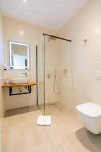 Koupelna v ubytování Corallo Rooms