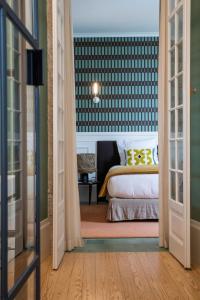 Postel nebo postele na pokoji v ubytování Sublime Lisboa