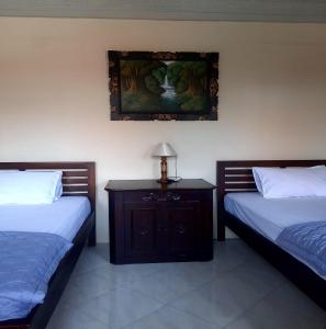 Postel nebo postele na pokoji v ubytování The Reinhold Guesthouse Bali