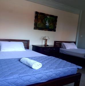 Postel nebo postele na pokoji v ubytování The Reinhold Guesthouse Bali