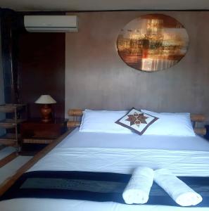 Postel nebo postele na pokoji v ubytování The Reinhold Guesthouse Bali