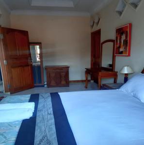 Postel nebo postele na pokoji v ubytování The Reinhold Guesthouse Bali