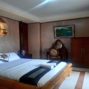 Postel nebo postele na pokoji v ubytování The Reinhold Guesthouse Bali