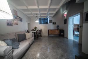 a living room with a couch and a table at La Cartapesta in Lecce