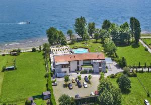 an aerial view of a house with a swimming pool at Tullio Hotel in Gravedona