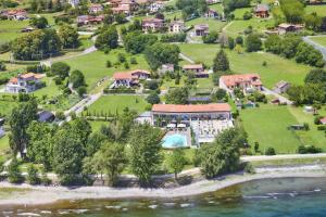 an aerial view of a house with a resort at Tullio Hotel in Gravedona