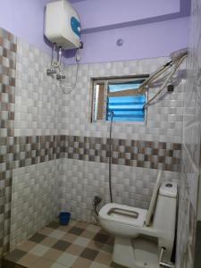 Ванна кімната в Ditto Room Hotel Kartik, Deoghar