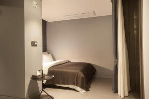 Säng eller sängar i ett rum på Hotel Gaden