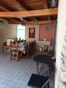 a patio with a table and chairs in a house at Casa SAN FELICE in Mori
