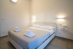 Postel nebo postele na pokoji v ubytování Il Crepuscolo Marzamemi