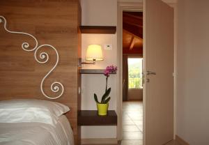 Posteľ alebo postele v izbe v ubytovaní Agriturismo Corte Aurea