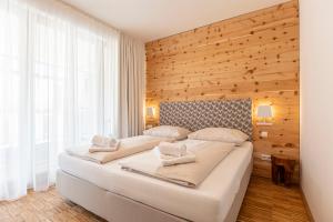 Łóżko lub łóżka w pokoju w obiekcie Alpenrock Schladming by ALPS RESORTS