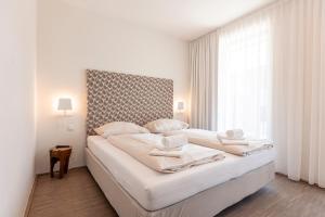Łóżko lub łóżka w pokoju w obiekcie Alpenrock Schladming by ALPS RESORTS