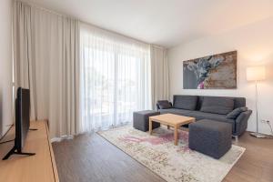 Telewizja i/lub zestaw kina domowego w obiekcie Alpenrock Schladming by ALPS RESORTS
