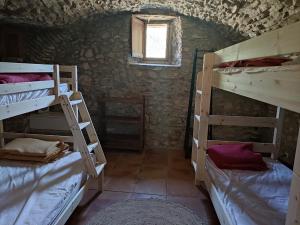 Voodi või voodid majutusasutuse Gîte de Navacelles toas