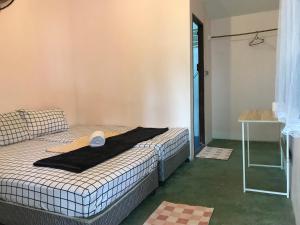 Postel nebo postele na pokoji v ubytování Phangan Villa Bungalows
