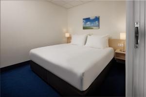 Voodi või voodid majutusasutuse WestCord Hotel Schylge toas