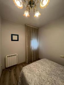 Postel nebo postele na pokoji v ubytování Apartamento playa A Ribeira