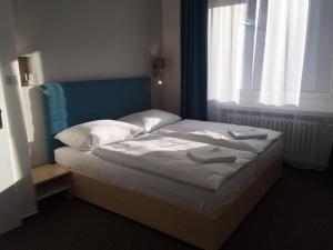 Postel nebo postele na pokoji v ubytování Hotel Trim