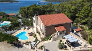 an aerial view of a house with a swimming pool at Villa Milina Korčula in Vela Luka